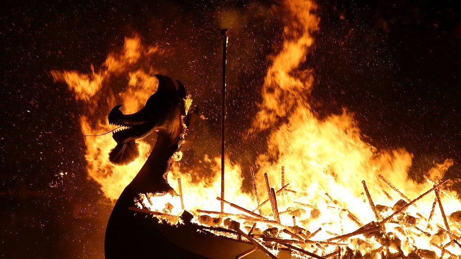 The Galley is burned by Guizer Jarl Mark Evans and members of the Jarl Squad, during the Up Helly Aa Viking festival in Lerwick on the Shetland Isles