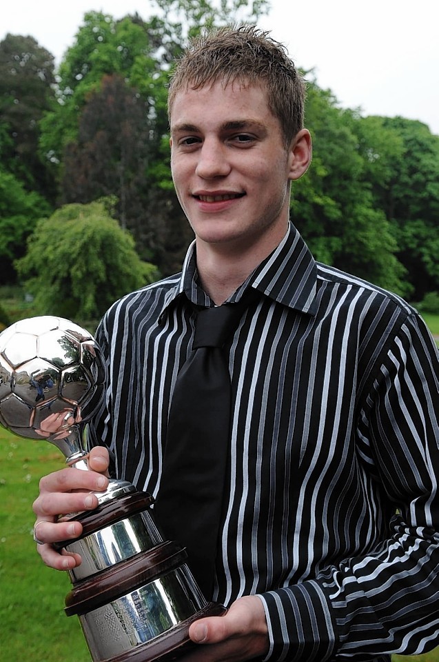 Coutts collects the player of the year award while playing for Cove 