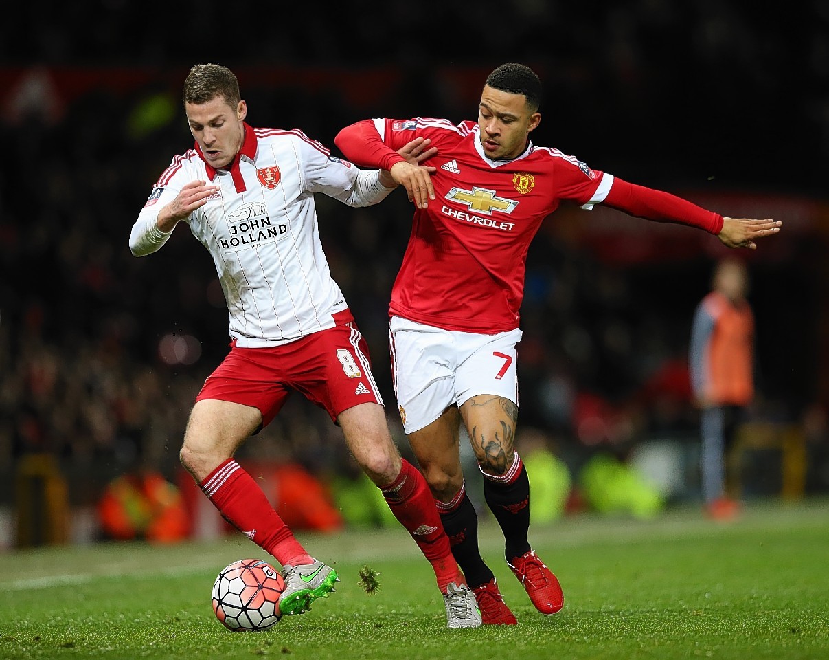 Coutts takes on Memphis Depay of Manchester United