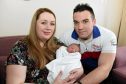 Rowena and Finlay MacDonald, from Skye, with their newborn son, Ryo, at Raigmore Hospital, Inverness