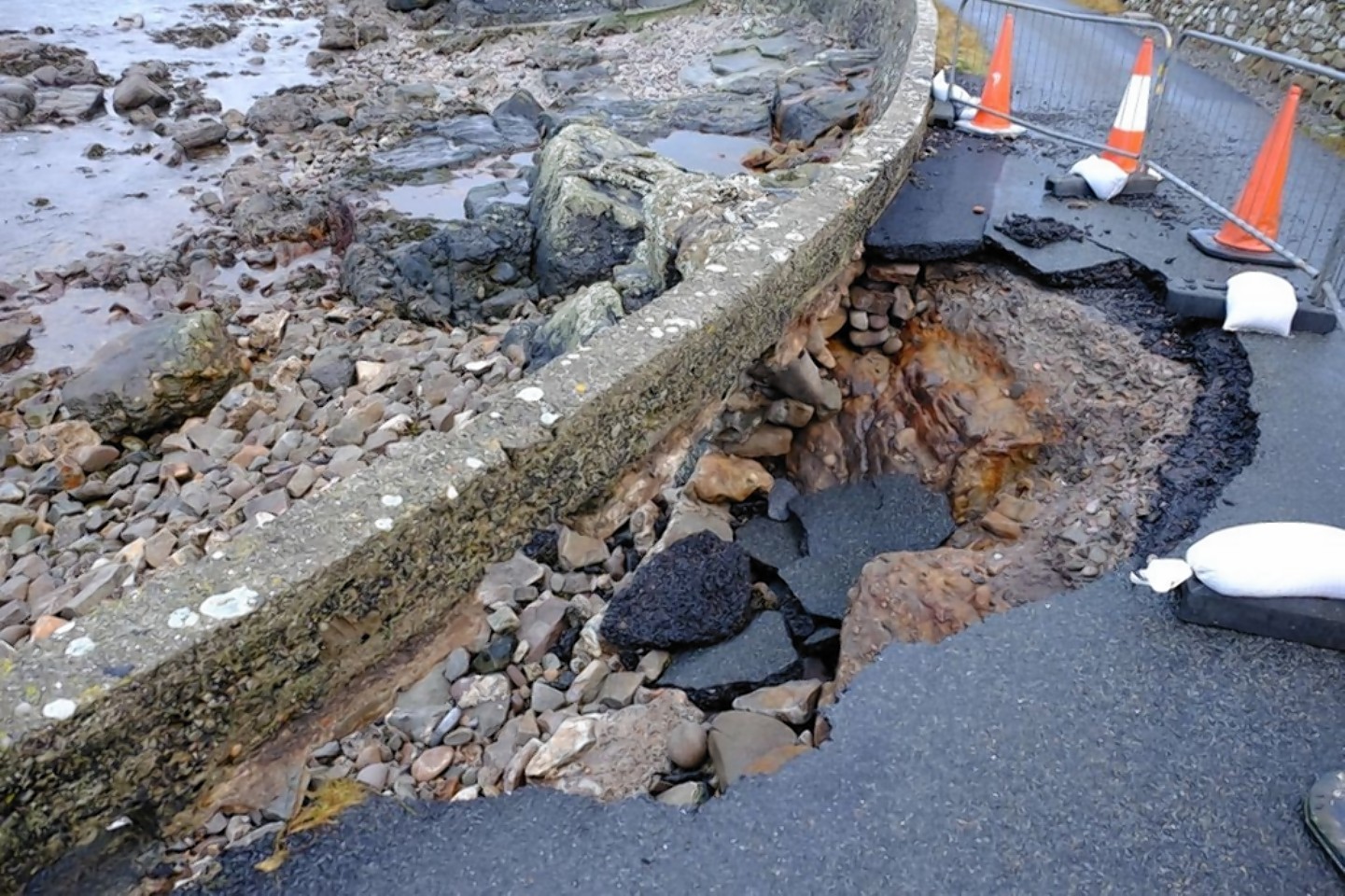 Repair work is under way on the sea road in Lerwick where the weather has taken its toll, leaving families unable to reach their homes by car. 
