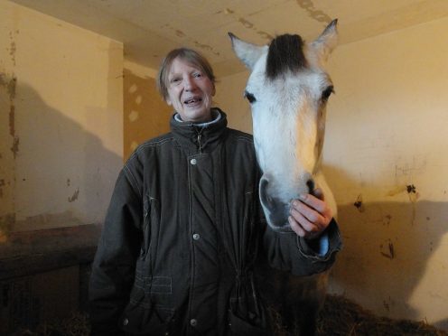 Stephanie Ann Noble with the horse in her front room