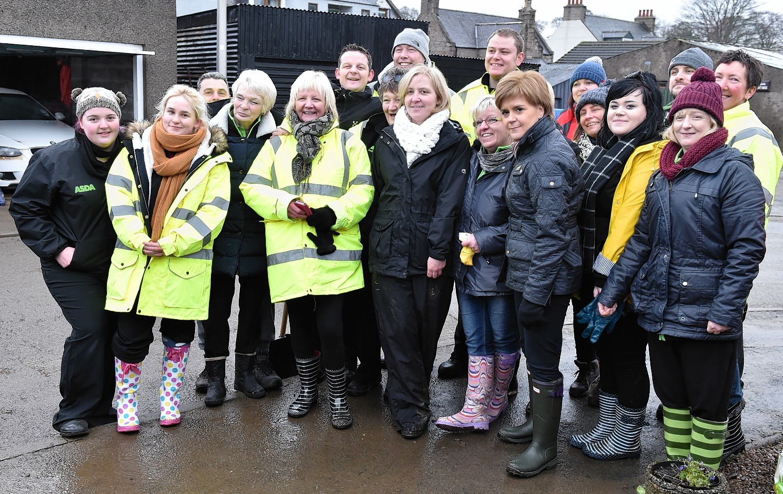 Nicola Sturgeon with ASDA volunteers helping with the clear-up in in Port Elphinstone. Picture by Colin Rennie 