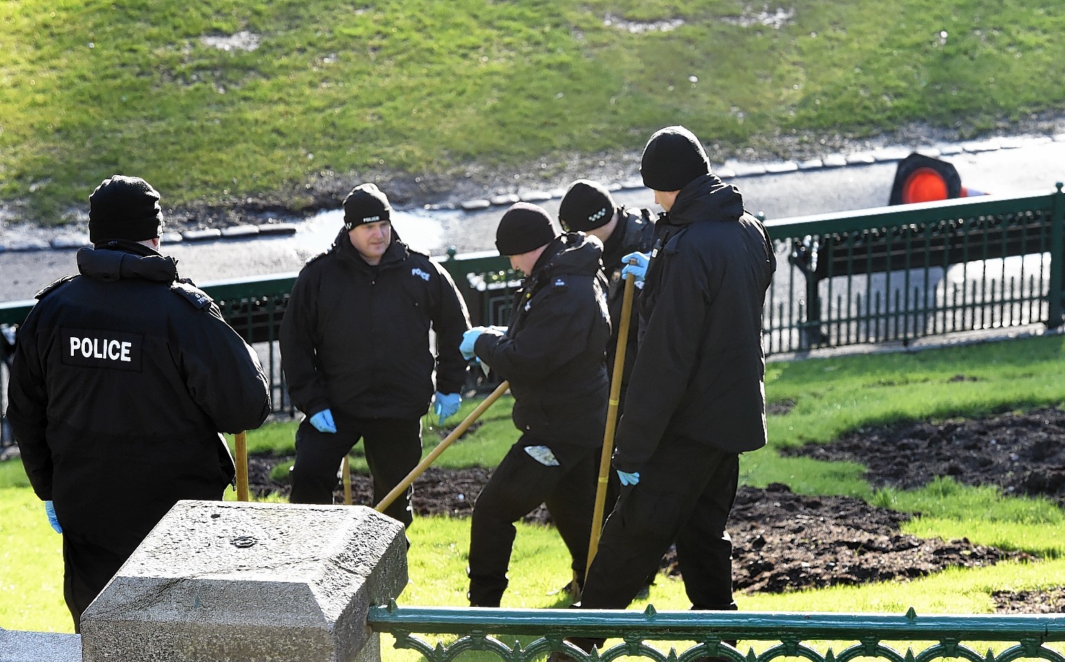 Police officers search Union Terrace Gardens in the days after the rape. (Picture: Kami Thomson)