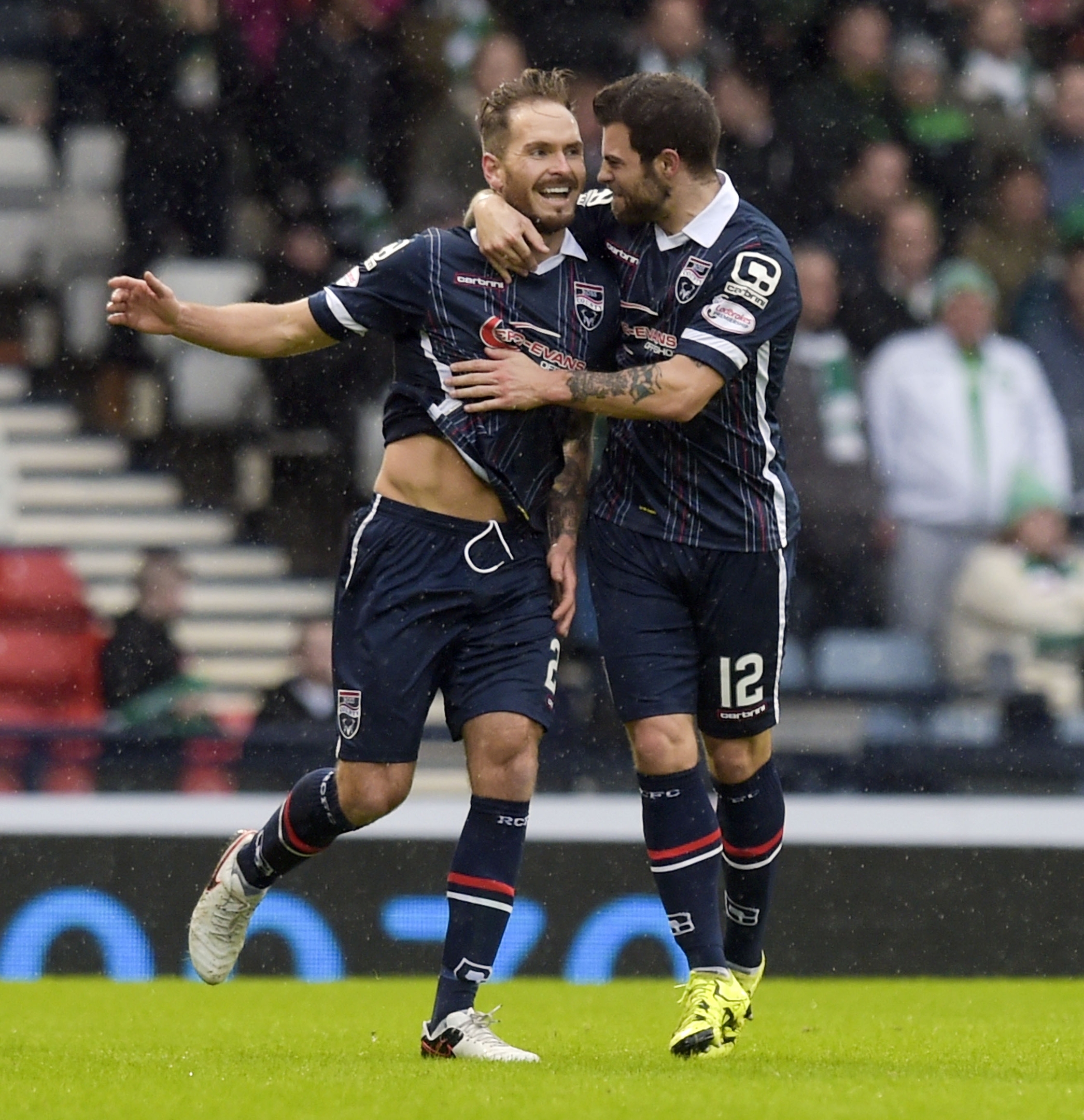 Ross County's Martin Woods (left) celebrates after making it 1-1 but a number of Staggies fans were forced to miss the game