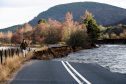 Part of the A93 washed away due to flooding between Bridge of Gairn and Crathie. Picture by Kevin Emslie