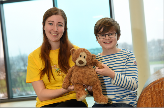 10 year old Archie Braidwood has been reunited with his lost teddy bear (Boots) after a public appeal from The ARCHIE Foundation.
Picture of Emma Slesser and Archie Braidwood with Boots the teddy bear