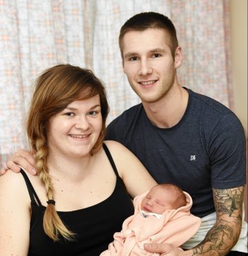 Tanya Ross and Brian Cameron with their newborn daughter