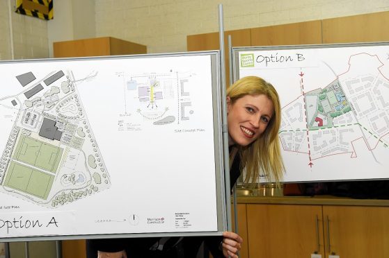 Kathryn Evans, Project Leader of Moray Sports Centre, with optional plans for the new sports centre. Picture by Gordon Lennox