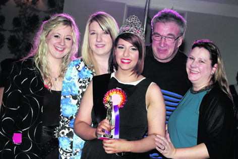 Zoe Macleod, who was crowned Miss Catsuit, with her family
