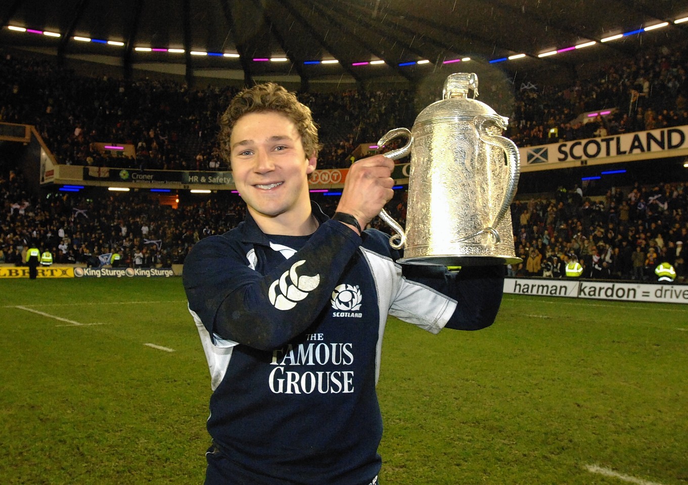 Scotland scrum half, Chris Cusiter, lifts the Calcutta Cup after helping the team to beat the  English 18-12 in 2006