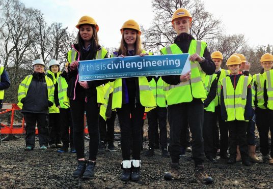 Pupils from Alford and Banchory academies on the building site where the A93 is being repaired.
