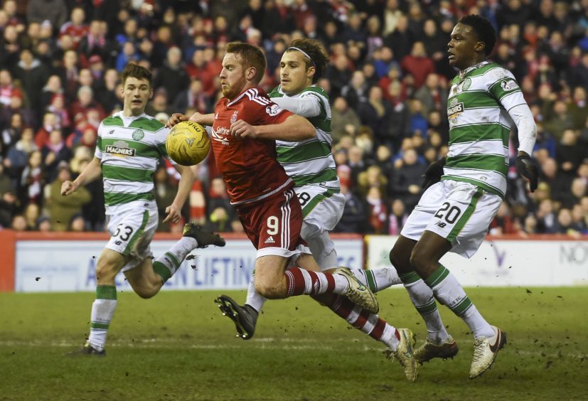 Aberdeen's Adam Rooney is brought down inside the box but no penalty is awarded