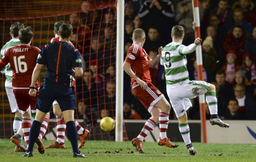 Celtic's Leigh Griffiths (right) pulls back a late goal