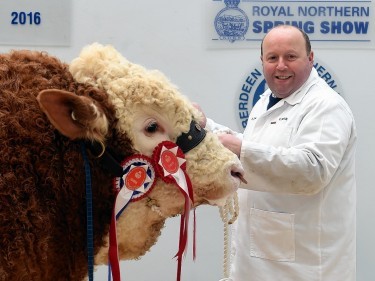 Iain Green with the Simmental champion