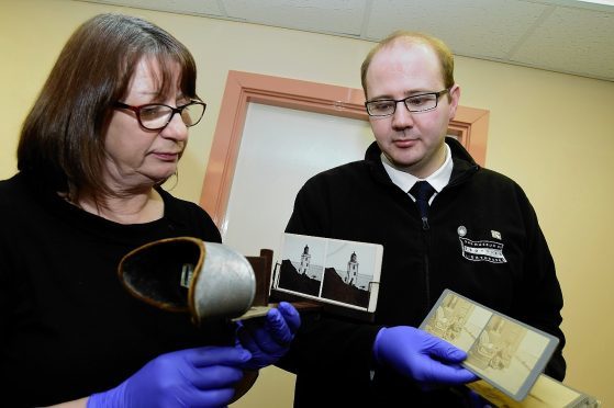 Manager Lynda McGuigan and collections manager Michael Strachan with the finds.