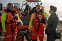 The Princess Royal speaking to Donald Watson, left and Ian Cassells, right, both members of Moray Inshore Rescue Organisation at Findhorn