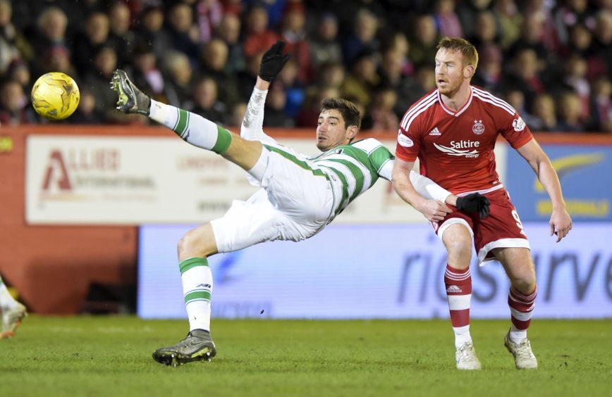 Celtic's Nir Bitton (left) battles with Adam Rooney