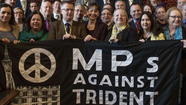 MPs hold a banner following a CND press conference to announce a Stop Trident demonstration in London