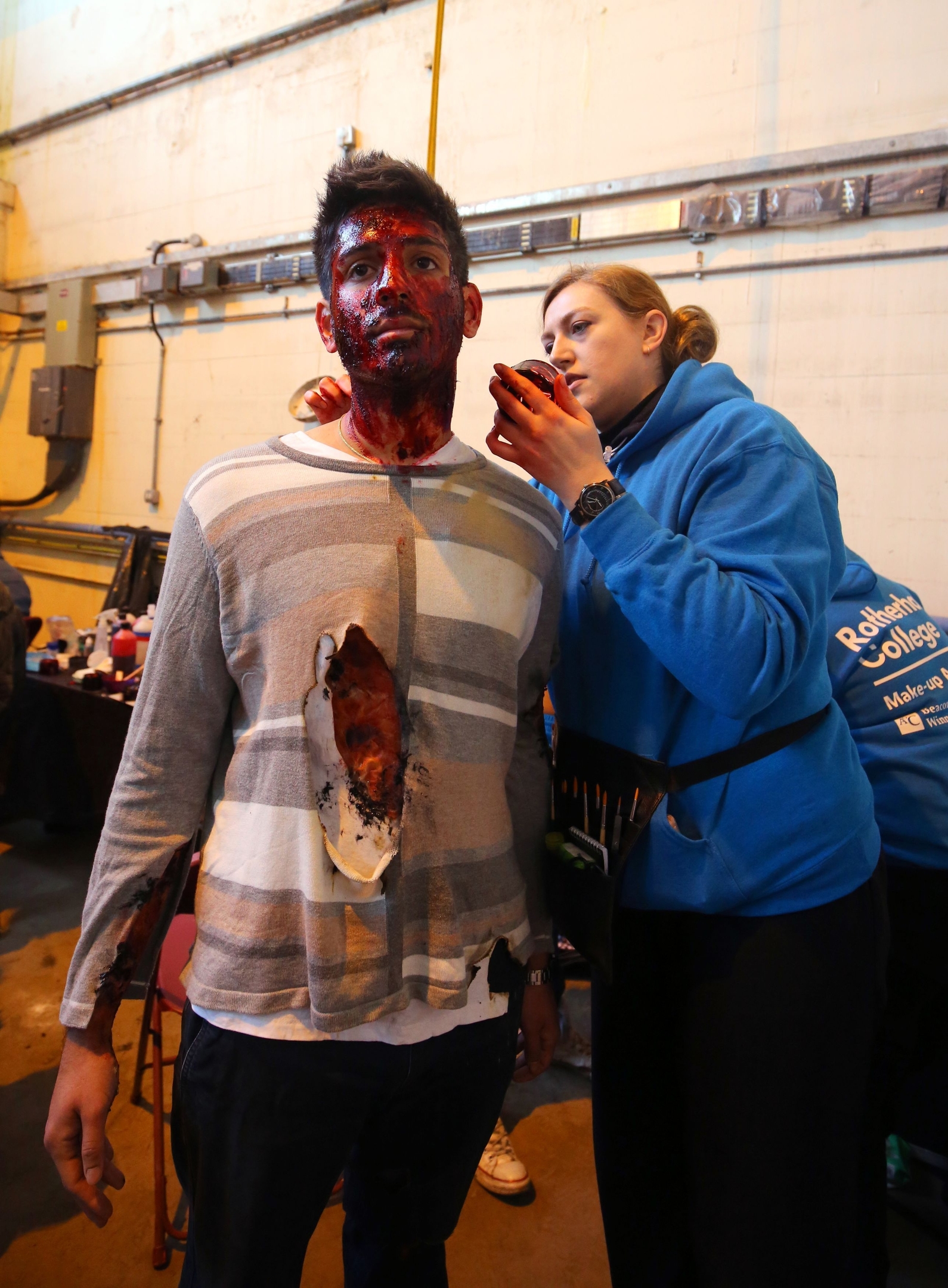 An actor is prepared in make-up for Exercise Unified Response, an emergency services training exercise at Littlebrook Power Station in Dartford, Kent 
