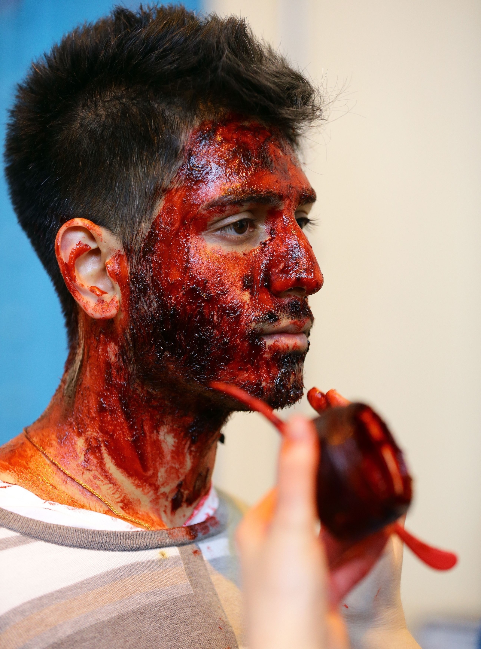 An actor is prepared in make-up for Exercise Unified Response, an emergency services training exercise at Littlebrook Power Station in Dartford, Kent. 