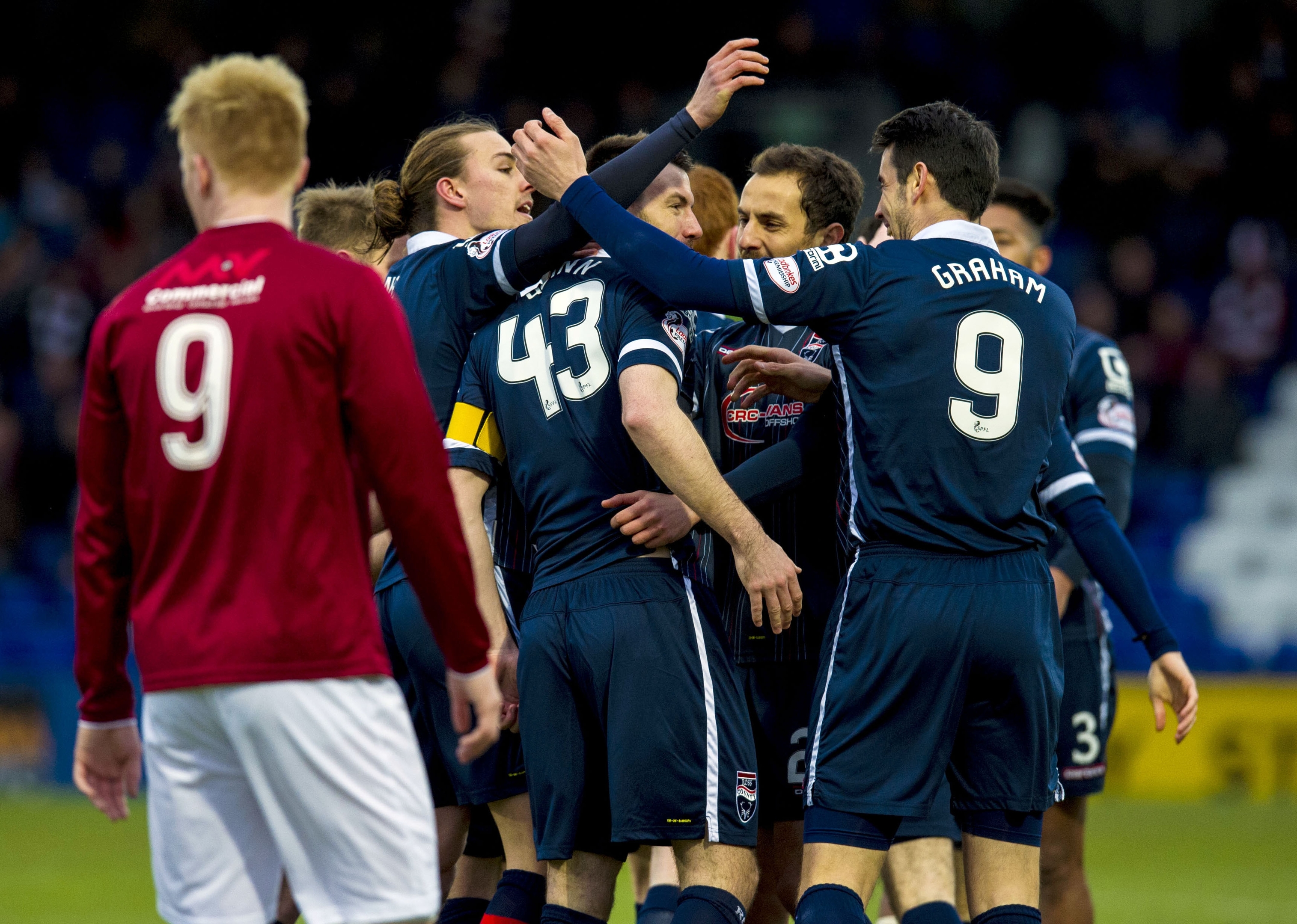 Ross County's Paul Quinn (centre) celebrates after making it 1-0