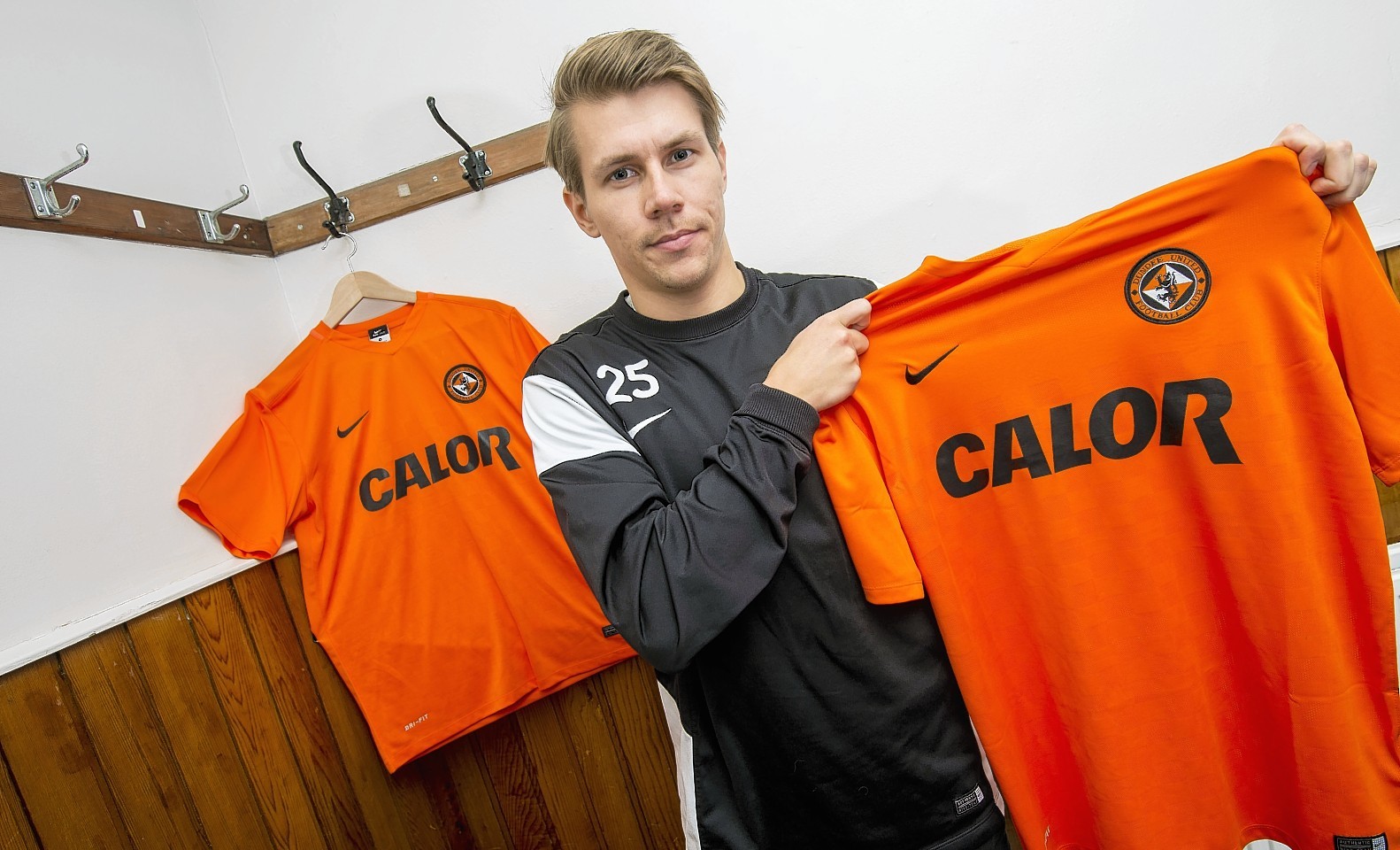 Riski looks delighted to join Dundee United's relegation dogfight