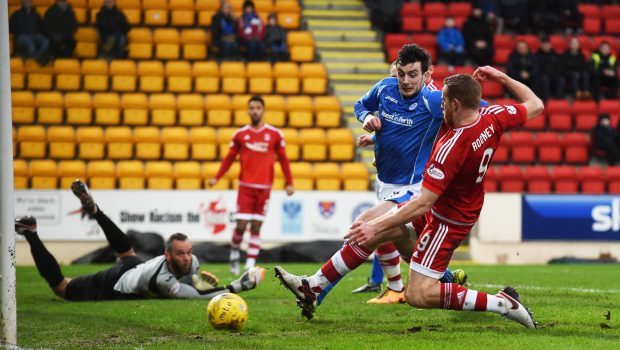 Adam Rooney (right) opens the scoring for the Dons on Saturday