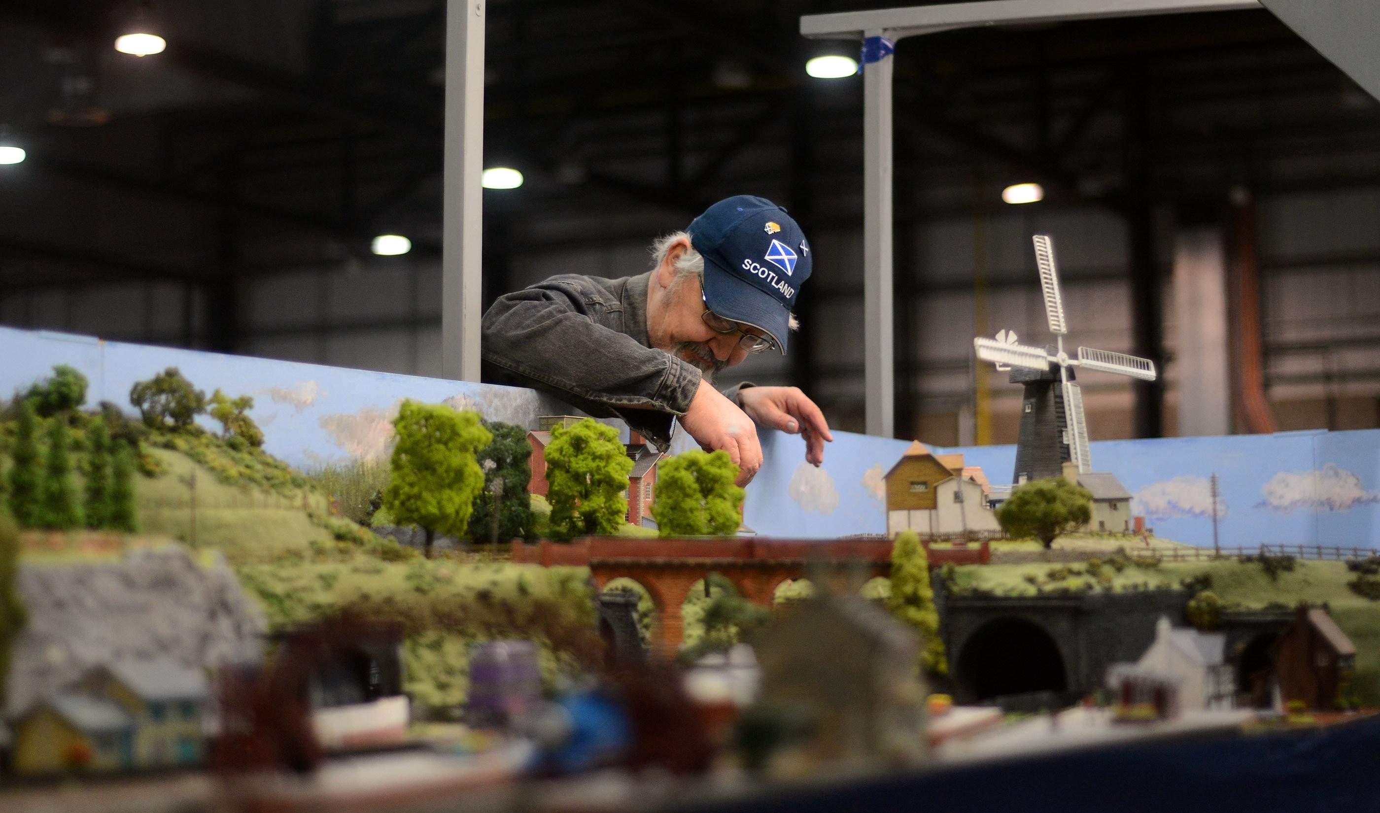 Sandy Oliphant gets his layout ready, a model of the railway stations from Thomas the Tank Engine, Hogwarts Express from Harry Potter and Underground Ernie, ahead of the 50th annual gathering of model railway enthusiasts displaying at Glasgow's SECC from tomorrow, Friday 26th to Sunday 28th Febuary, where 30 different clubs from across the UK and further are expected to display. See Centre Press story CPRAIL; Thousands of model railway enthusiasts gather for convention.