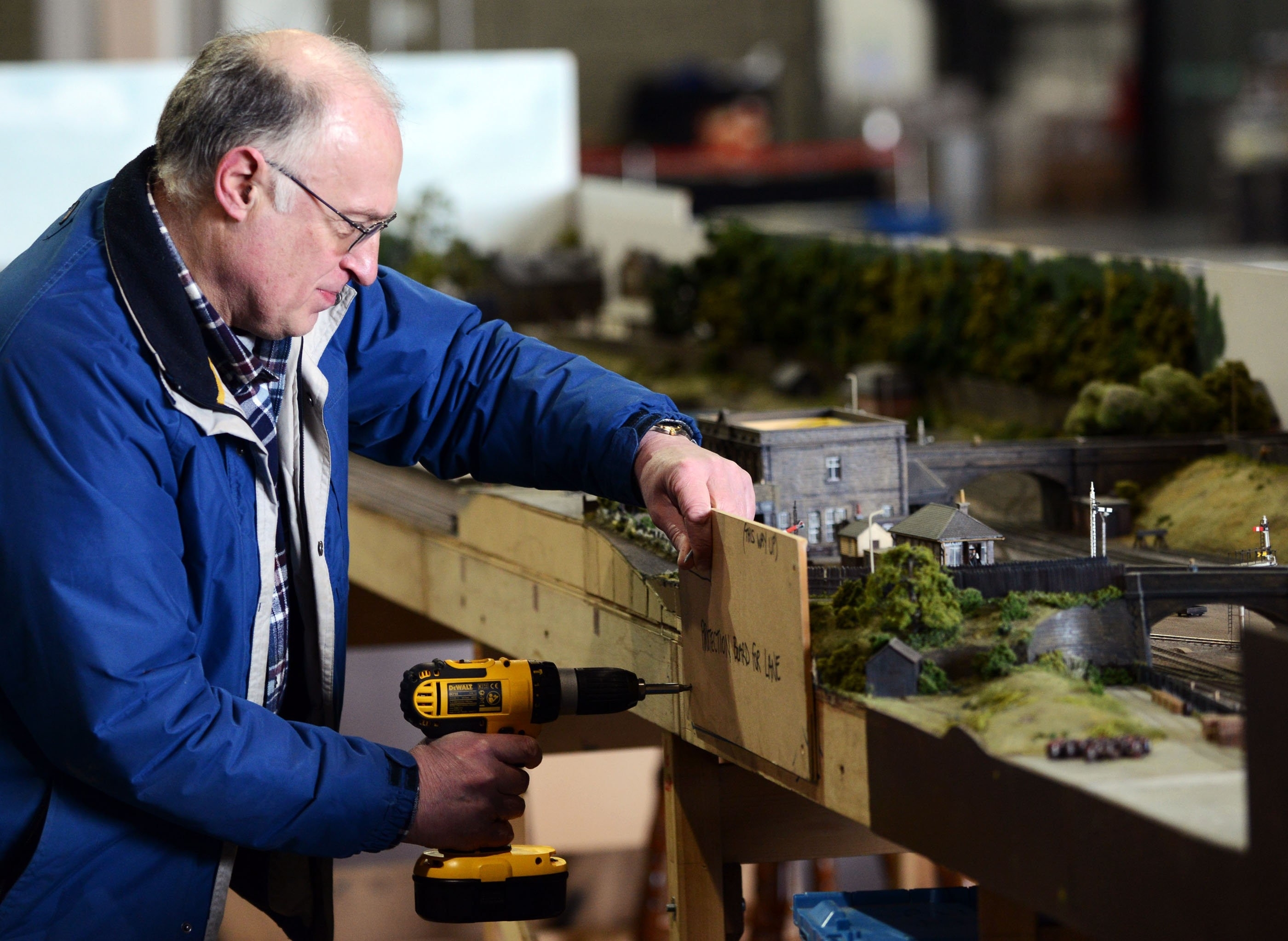 Members get their layout ready, a model of the Old Railway Station in Alloa, ahead of the 50th annual gathering of model railway enthusiasts displaying at Glasgow's SECC from tomorrow, Friday 26th to Sunday 28th Febuary, where 30 different clubs from across the UK and further are expected to display.