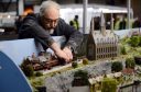 Sandy Oliphant  gets his layout ready, a model of the railway stations from Thomas the Tank Engine, Hogwarts Express