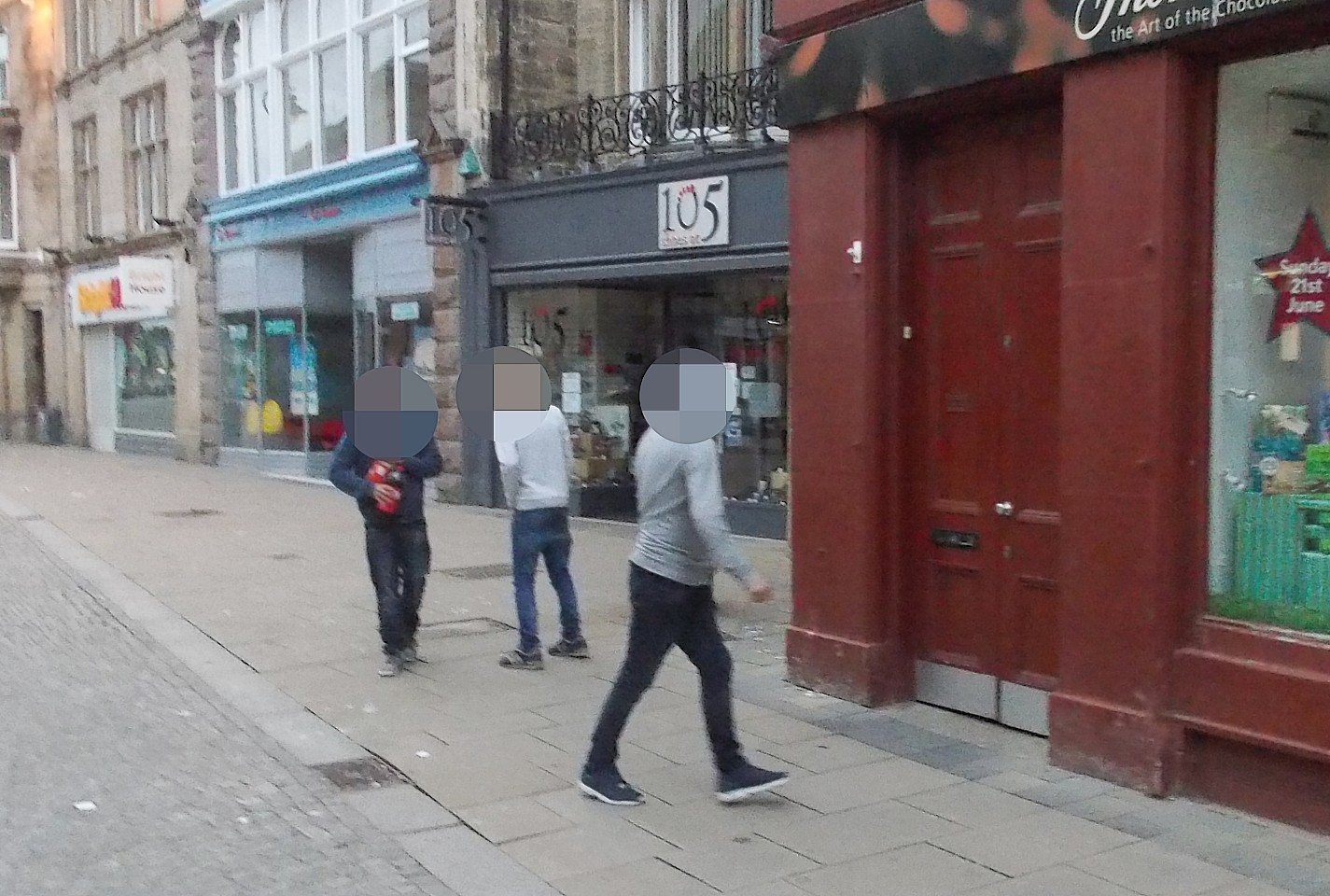 The teenagers that Mr Rigley photographed in Elgin High Street before he was viciously assaulted.