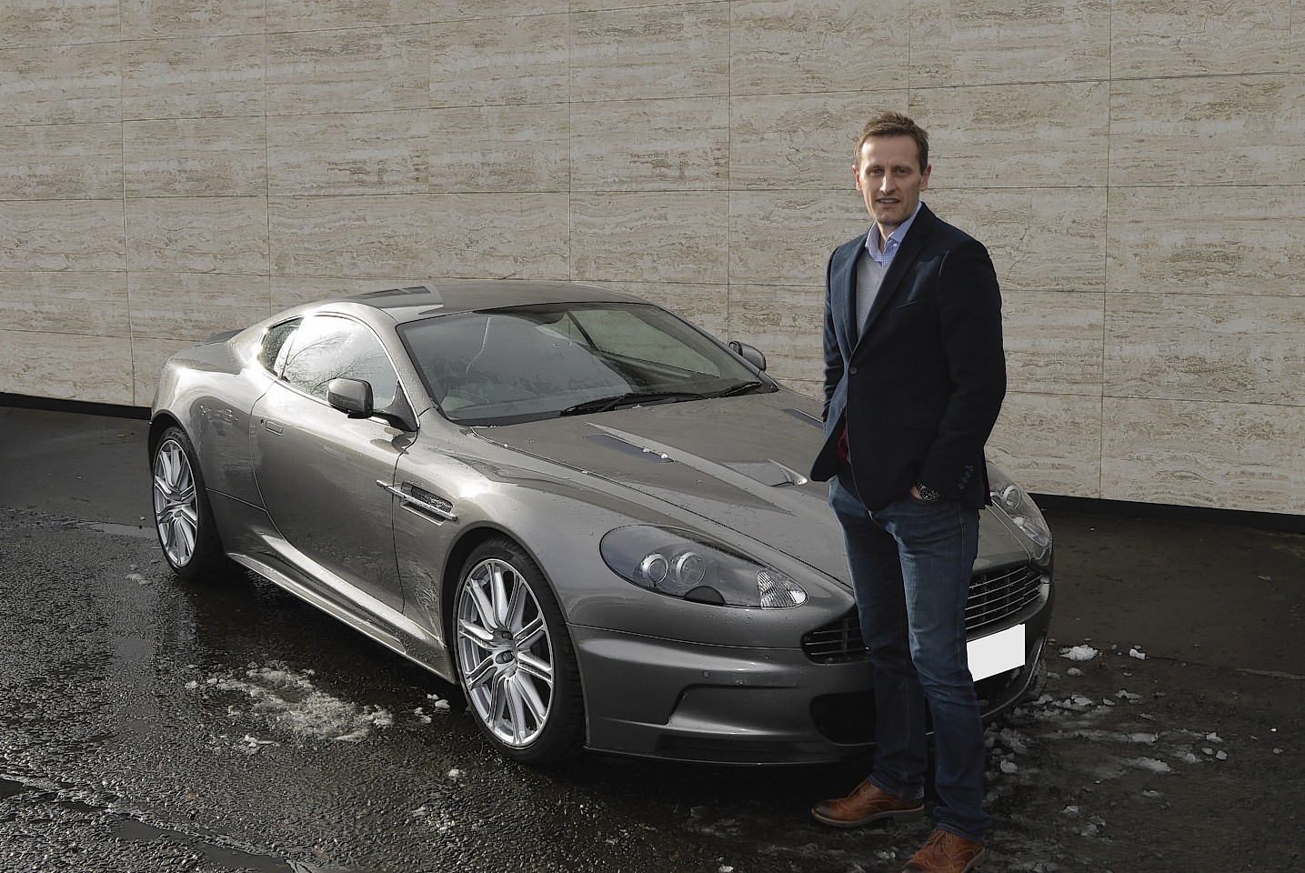 Neil Mitchinson with one of the pawned cars on his books