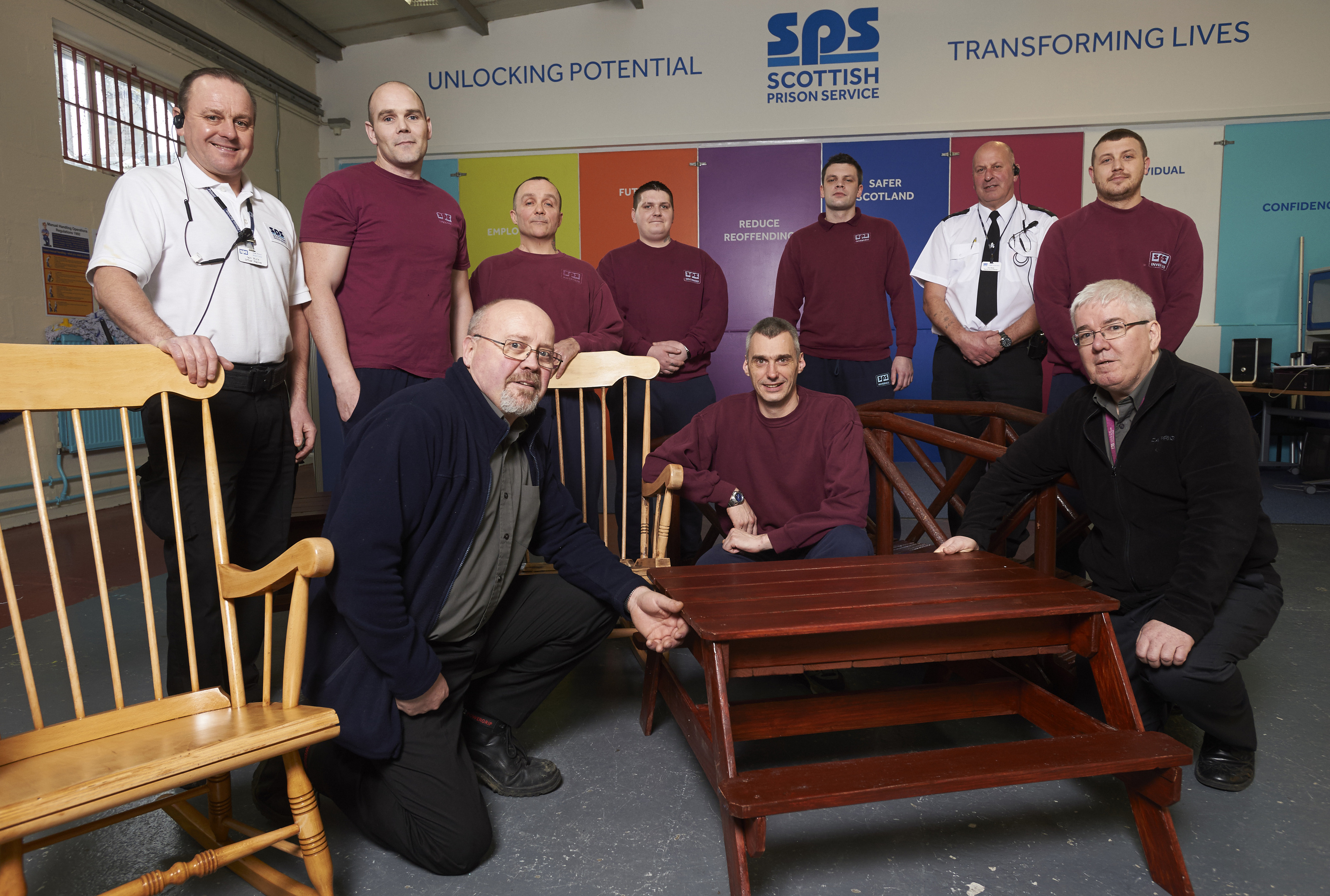 Group of prisoners pictured with Iain Wylie (left) and Eric Robb (SPS Officers) with Martin Robb (Front left) and David Parker (Front right) from Inverness College.