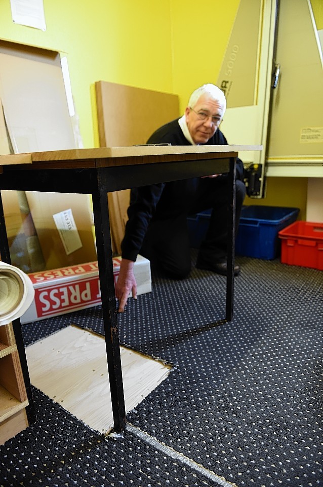 Martin Burbridge, owner of the Picture Framer shop in North Street, Elgin where thieves cut through floorboards