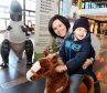 Phillip Eloff, 3, with his mum, Carina, at the Barnardo's stand in Union Square, Aberdeen.
Picturn by Jim I.rvine