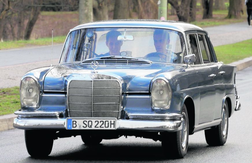 Sacha Baron Cohen sighted driving a classic Mercedes on February 24 in Berlin