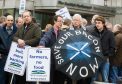 Farmers gathered outside Holyrood in March over late subsidy payments