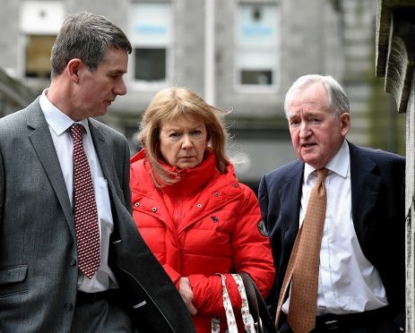 Anne Croft with her husband (left) and Frank LeFevre of Quantum Claims.