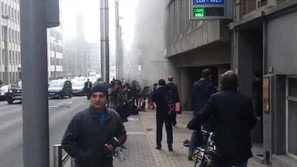 People streamed from the Metro station near the European Parliament after the explosion