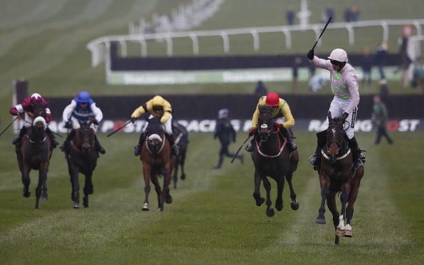 Ruby Walsh riding Douvan to victory in The Racing Post Arkle Challenge Trophy on day one at Cheltenham