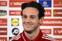 Danny Ward is all smiles as he speaks to the press