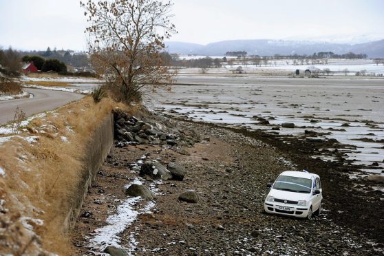 The damaged Fiat Panda which crashed on to the foreshore on the Cromarty Firth on Wednesday morning close to Jemimaville