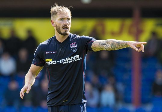 Martin Woods in action for Ross County
