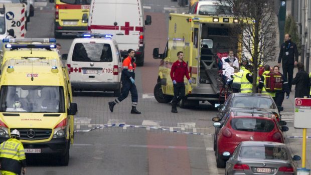 A woman is evacuated in an ambulance by emergency services after a explosion in a main metro station in Brussels (AP)