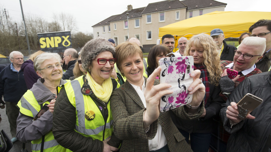 First Minister Nicola Sturgeon takes a selfie as she campaigns in Wishaw, North Lanarkshire