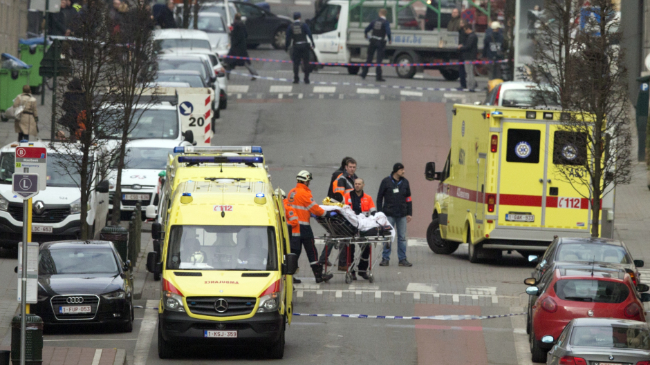 A victim is evacuated on a stretcher by emergency services after a explosion in a main metro station in Brussels (AP)