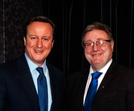 Prime Minister David Cameron with event organiser Bill Hopkins