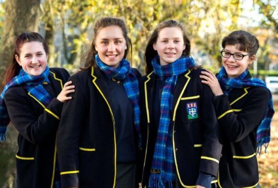 Students in their new tartan: Cassia Ogilvie, Lucy Harris, Abigail Miller and Isla Stott.