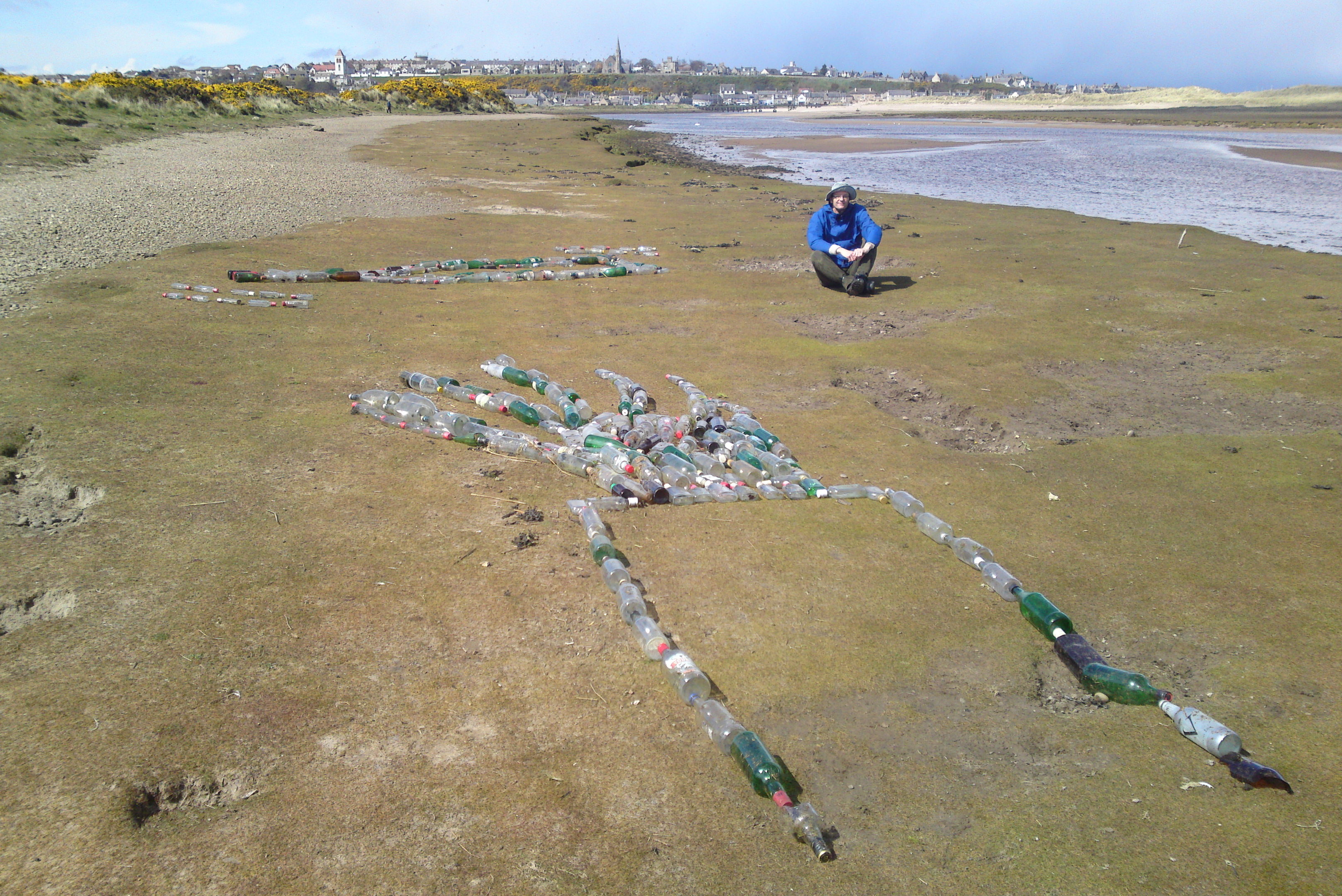 Pete Miner used almost 400 bottles to create the display to highlight litter on the Lossiemouth coast.